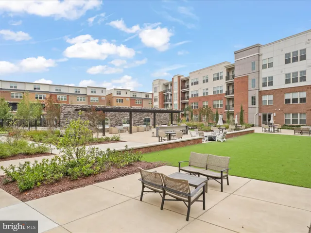 a view of roof deck with two chairs and a couch