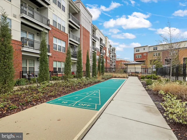 a view of outdoor space with playground and green space