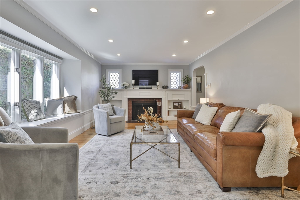 10 Lawndale Road Milton, MA 02186 - Photo 13 of 42 a living room with furniture and a fireplace