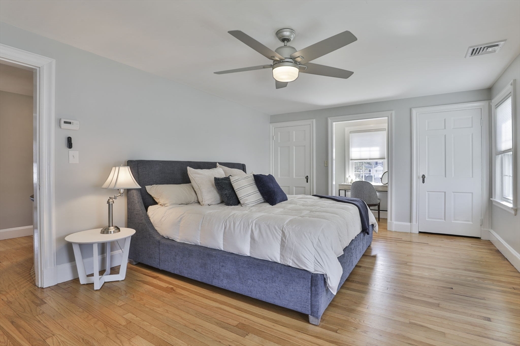 10 Lawndale Road Milton, MA 02186 - Photo 20 of 42 a spacious bedroom with a bed and a chandelier