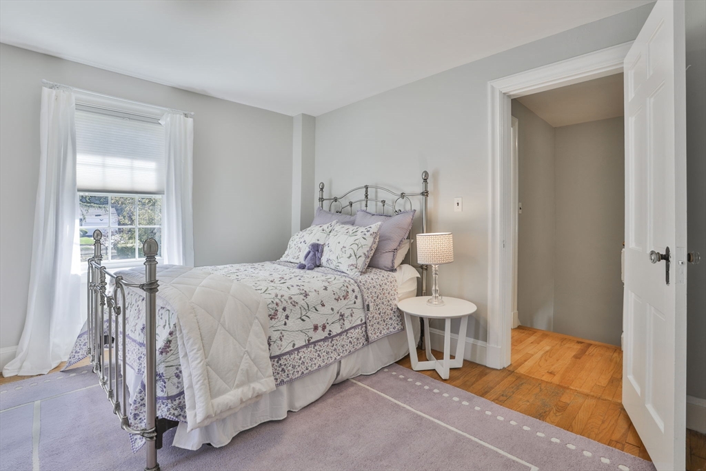 10 Lawndale Road Milton, MA 02186 - Photo 22 of 42 a bedroom with a bed and a lamp