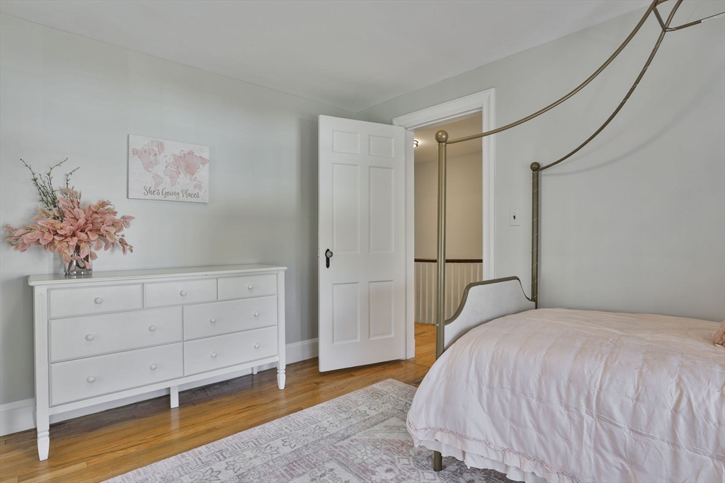 10 Lawndale Road Milton, MA 02186 - Photo 27 of 42 a bedroom with a bed and cabinet