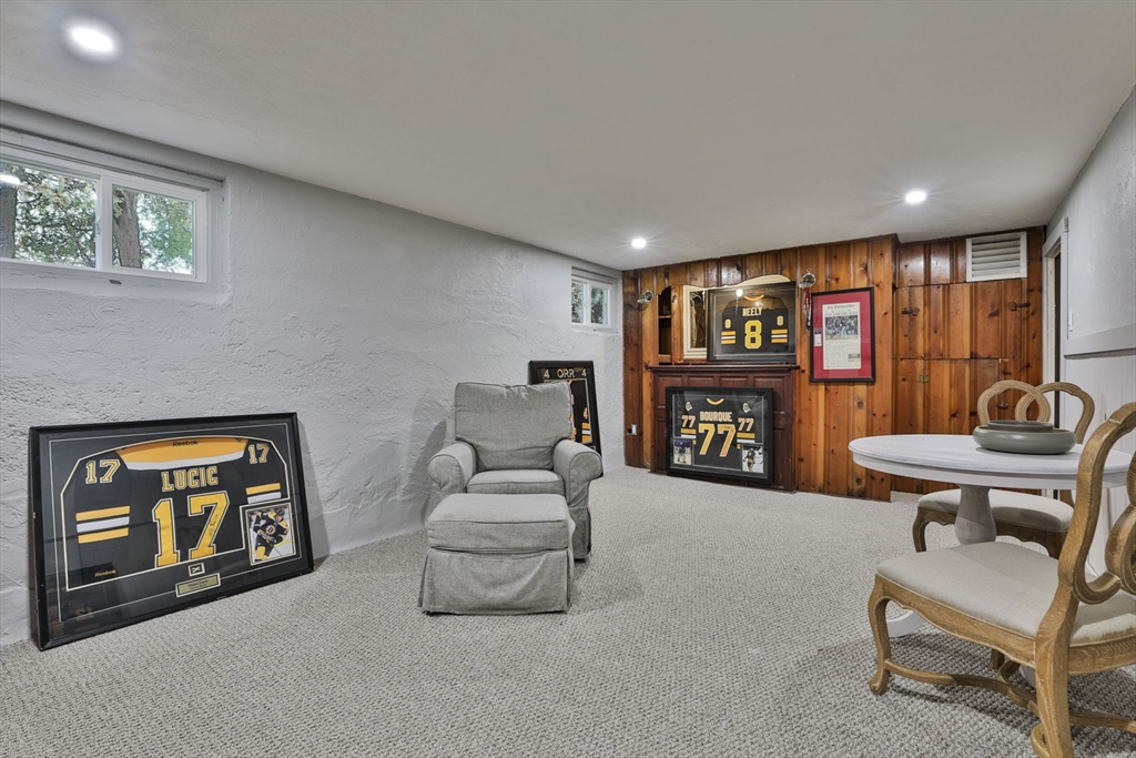 10 Lawndale Road Milton, MA 02186 - Photo 33 of 42 a living room with furniture and a bookshelf
