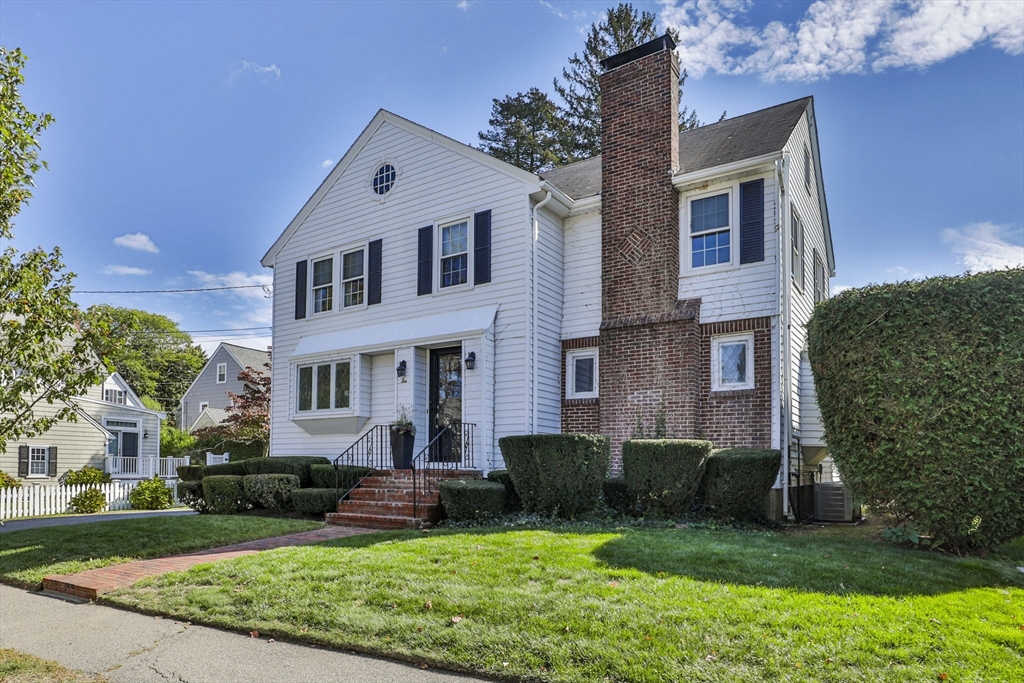 10 Lawndale Road Milton, MA 02186 - Photo 39 of 42 a front view of a house with a garden and plants