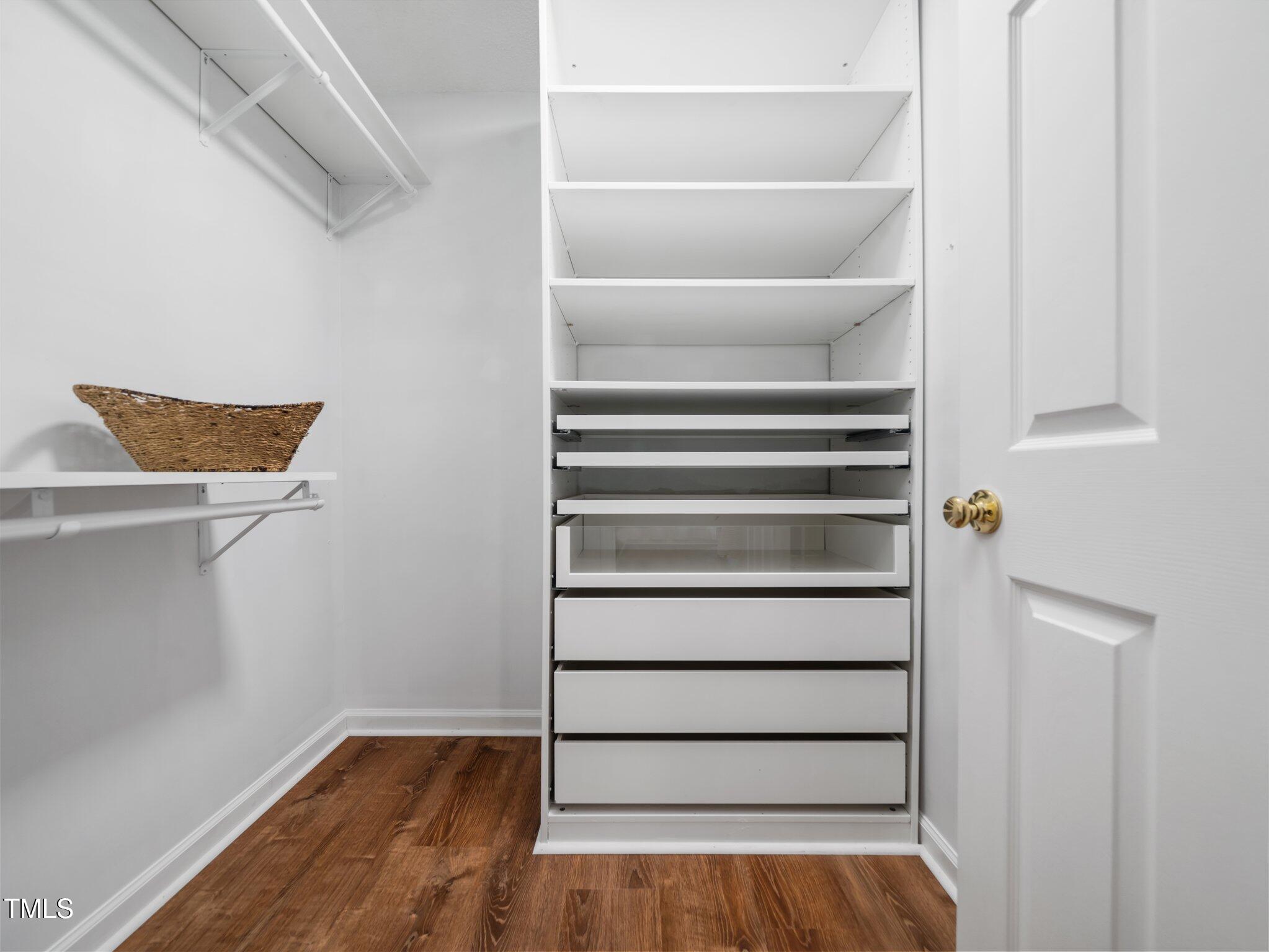 3400 Appling Way Durham, NC 27703 - Photo 13 of 30 a view of walk in closet with empty racks