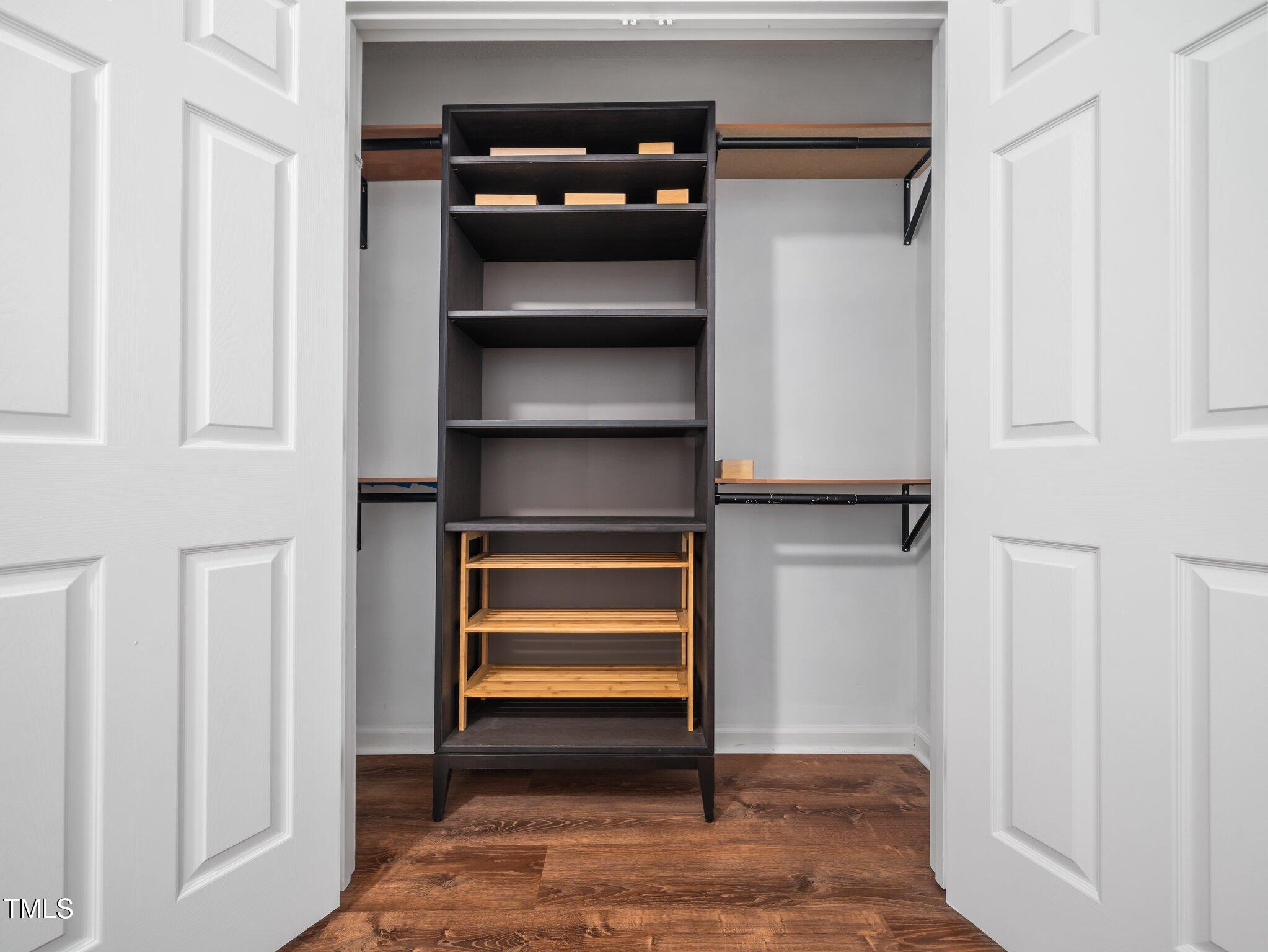 3400 Appling Way Durham, NC 27703 - Photo 14 of 30 a view of walk in closet with empty racks