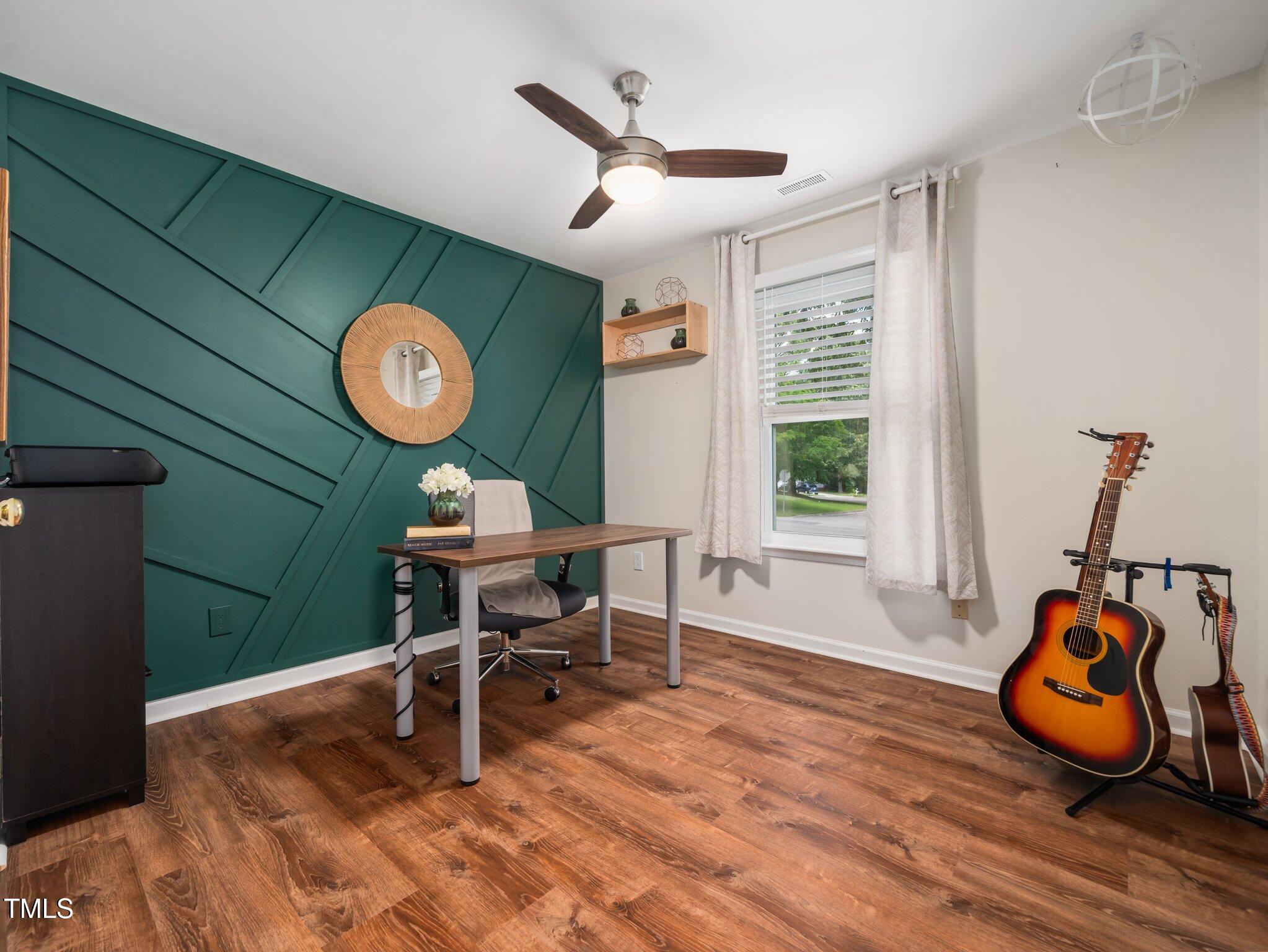 3400 Appling Way Durham, NC 27703 - Photo 21 of 30 a work room with wooden floor and a window