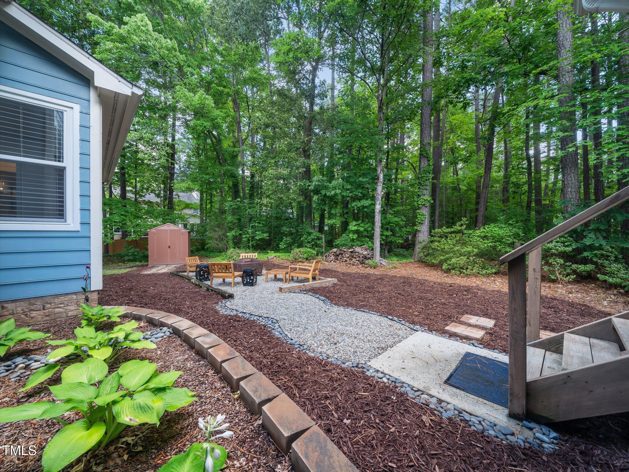 3400 Appling Way Durham, NC 27703 - Photo 25 of 30 a view of yard from deck with patio