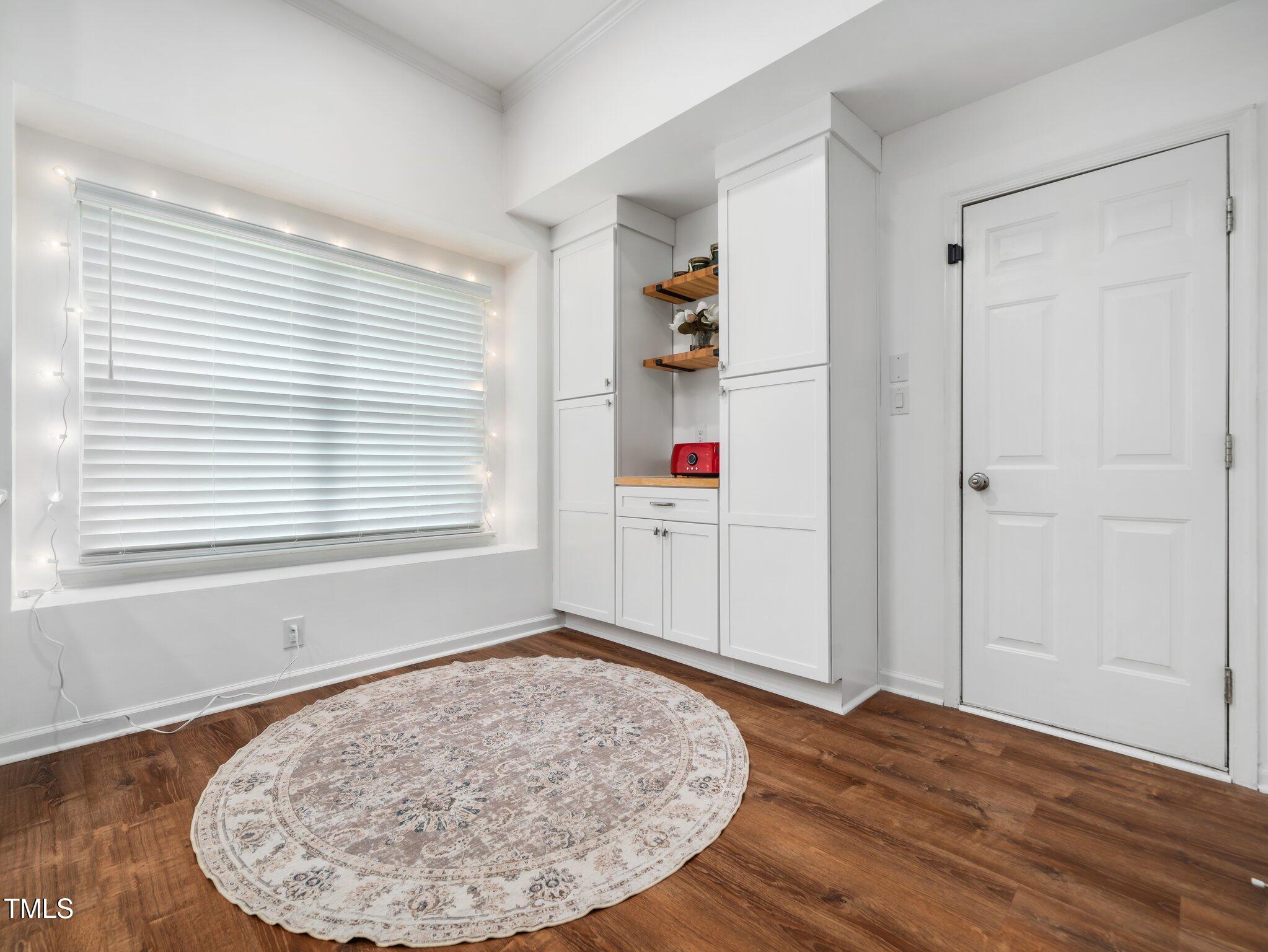 3400 Appling Way Durham, NC 27703 - Photo 10 of 30 an entryway of a room with wooden floor and a window