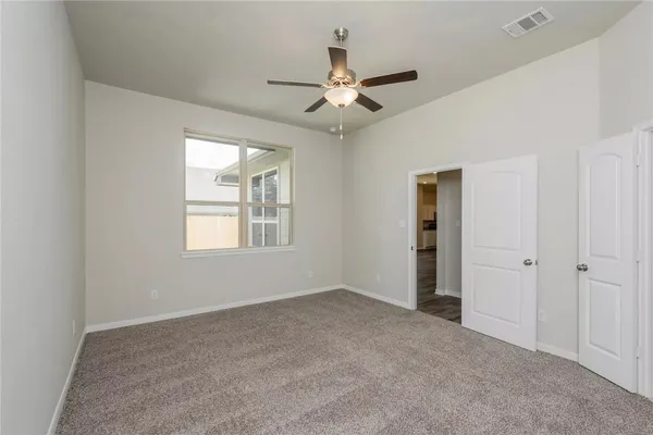 a view of an empty room and closet