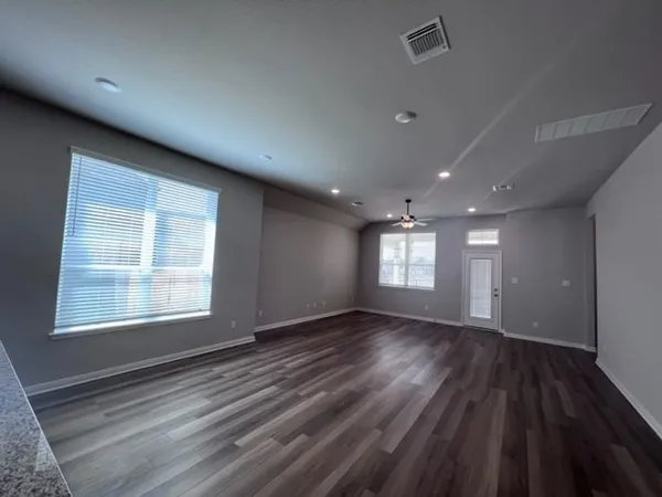 a view of an empty room with a window