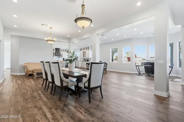 a view of a dining room with furniture and wooden floor