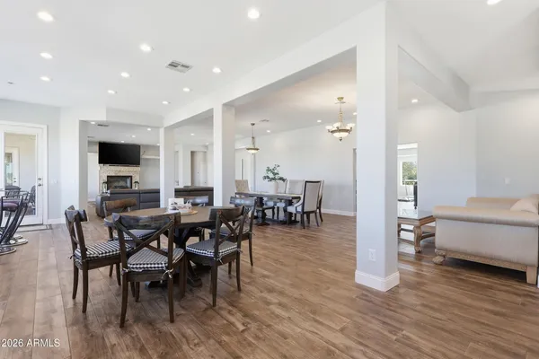 a large kitchen with kitchen island a sink appliances and cabinets