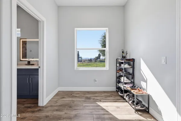 a view of walk in closet with clothes
