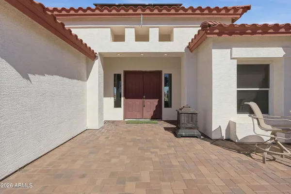 a view of a house with a yard and seating space