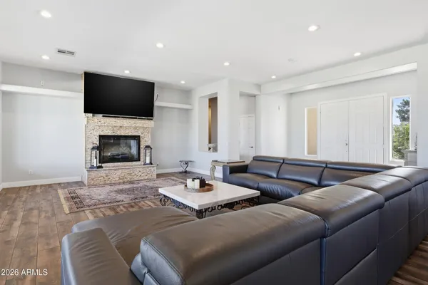 a living room with furniture and a rug