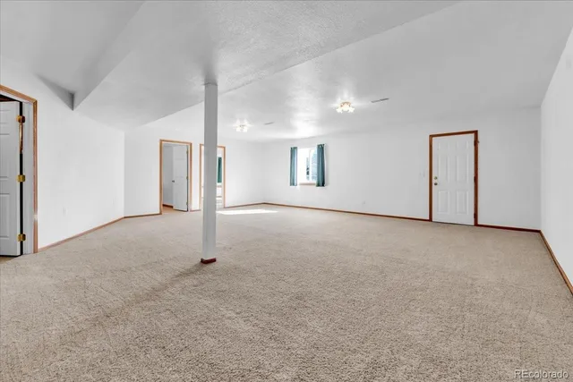 a spacious bathroom with a sink a mirror and a toilet