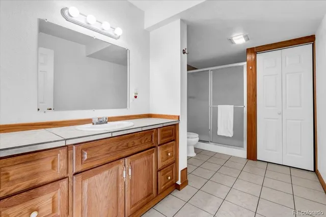 a view of an empty room with windows