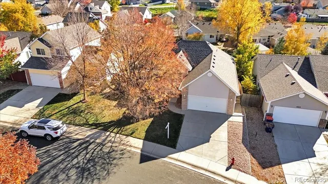 an aerial view of residential houses with outdoor space