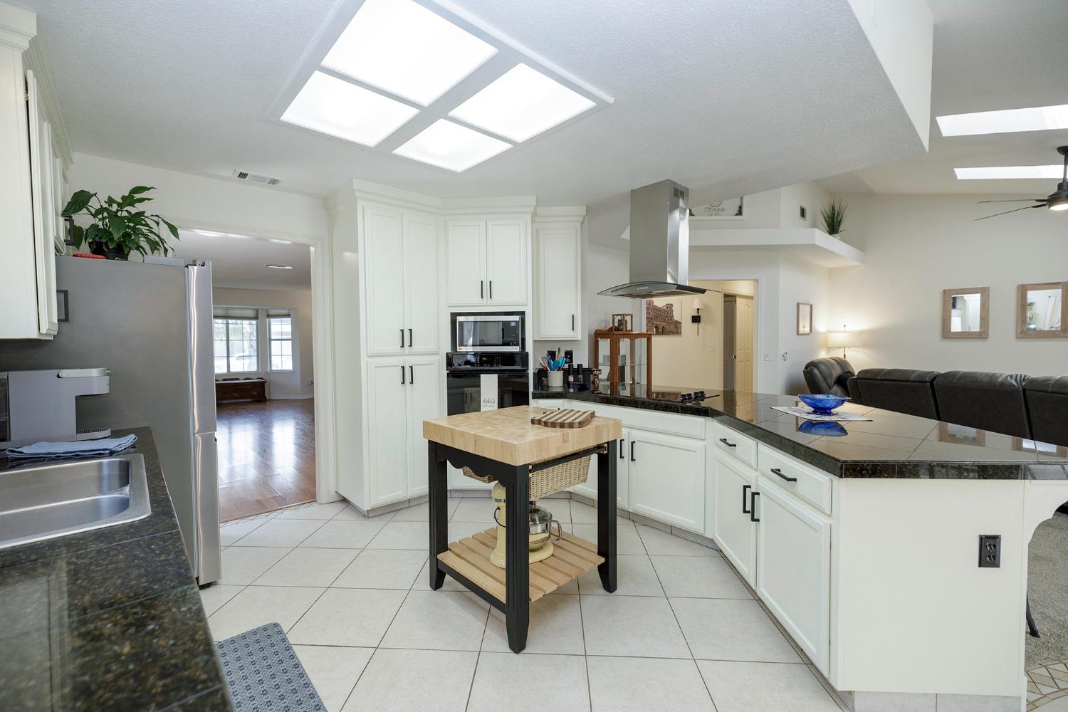 230 Meyenberg Avenue Ripon, CA 95366 - Photo 24 of 52 a kitchen with a sink a counter space and stainless steel appliances