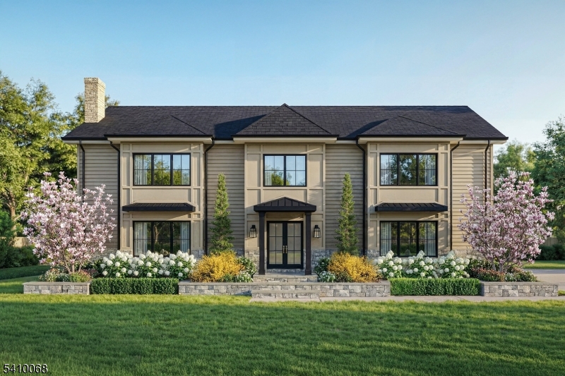 a front view of a house with a garden and porch