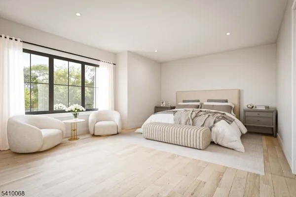 a bedroom with bed and glass window