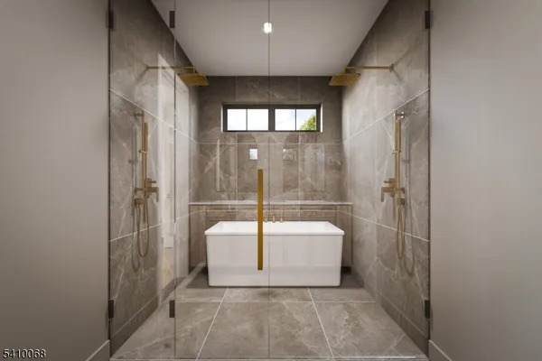 a spacious bathroom with a bathtub and a shower