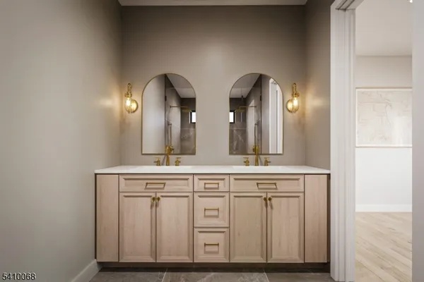 a view of hall way with furniture and mirror