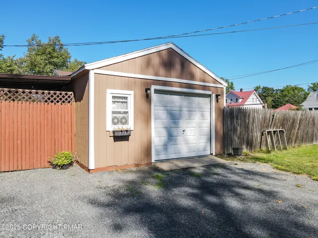 a kitchen with stainless steel appliances granite countertop a stove microwave refrigerator and sink