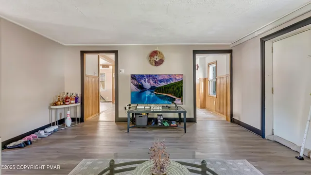 a kitchen with stainless steel appliances granite countertop a refrigerator and a stove