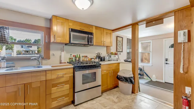 a bedroom with bed and a flat screen tv