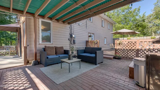 an aerial view of a house with a swimming pool