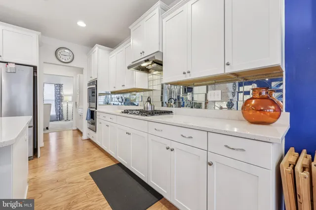 a kitchen with counter and cabinets
