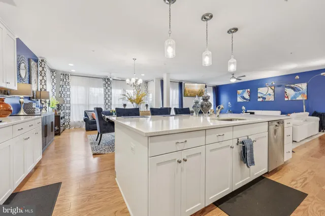 a large kitchen with kitchen island a sink a center island a stove and a center island