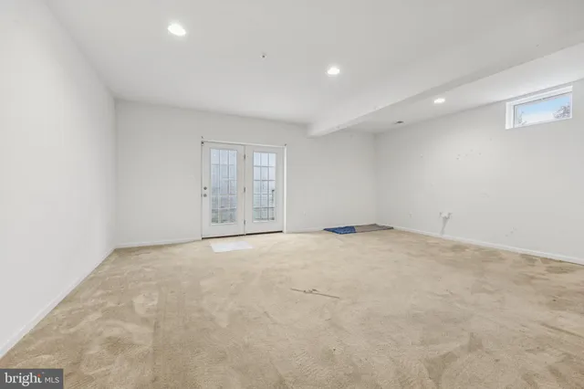 a view of kitchen with refrigerator and a sink