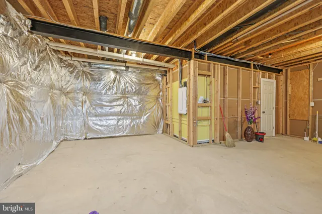 a house with green field in front of it