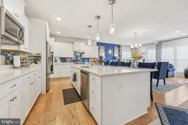 a kitchen with counter space cabinets and appliances