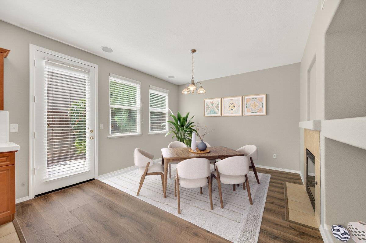 714 West Riviera Lane Clovis, CA 93619 - Photo 19 of 35 Family room staged virtually as a dining area