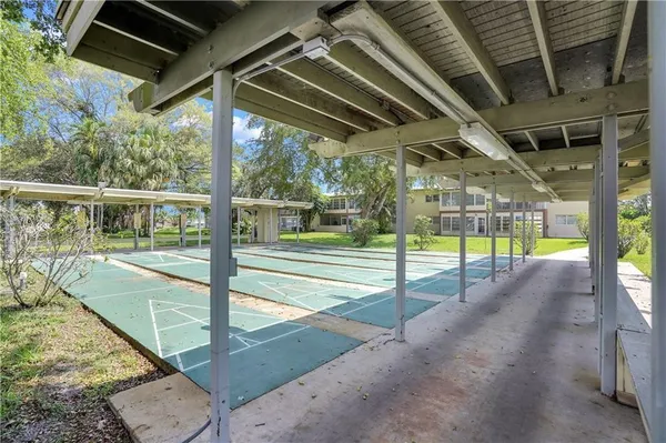 a view of a swimming pool with a porch