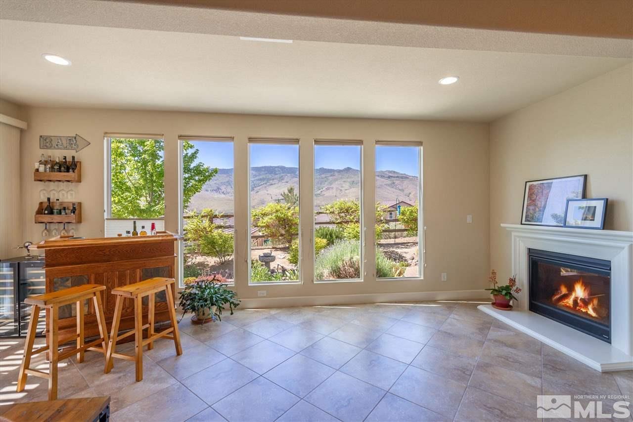1149 Dutch Hollow Trail Reno, NV 89523 - Photo 12 of 38 a view of an empty room with a fireplace and a window