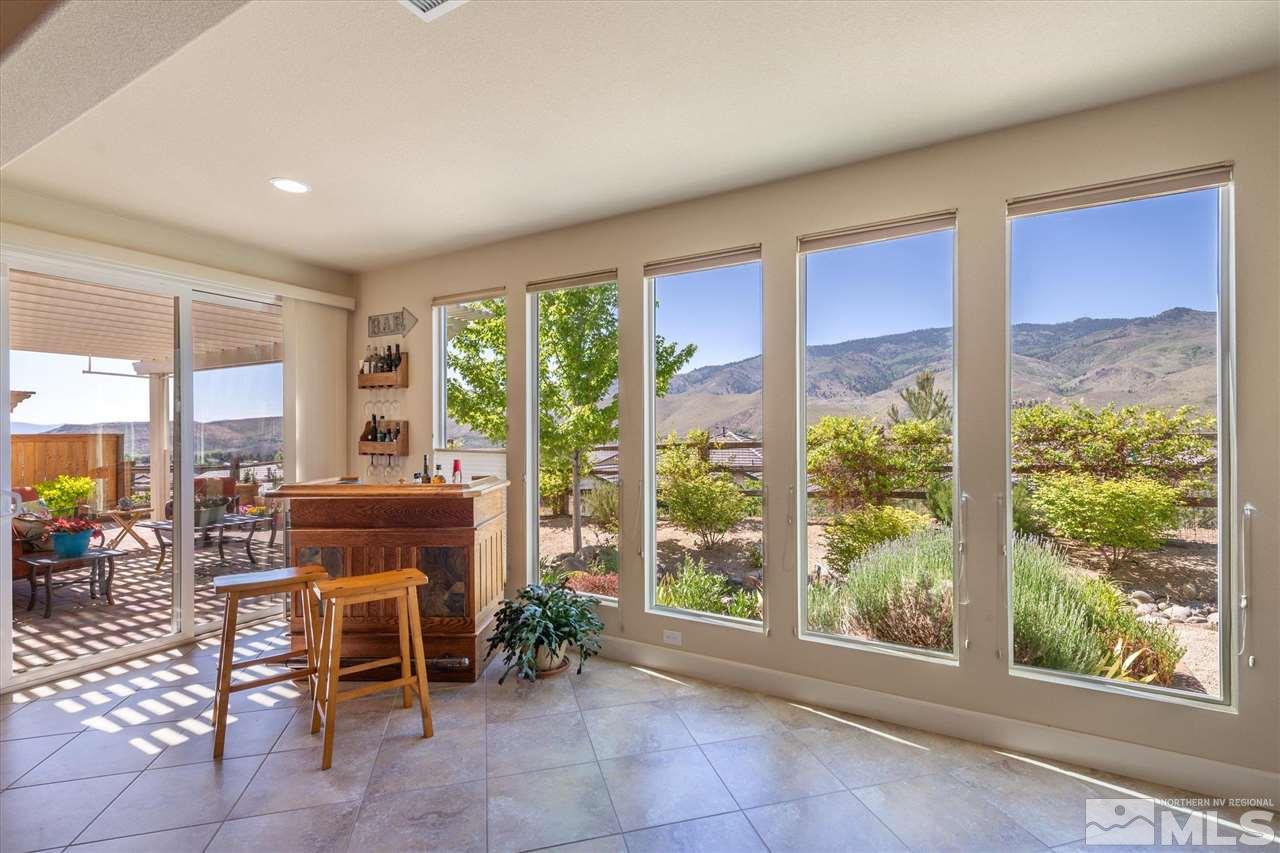 1149 Dutch Hollow Trail Reno, NV 89523 - Photo 13 of 38 a room with furniture and a floor to ceiling window