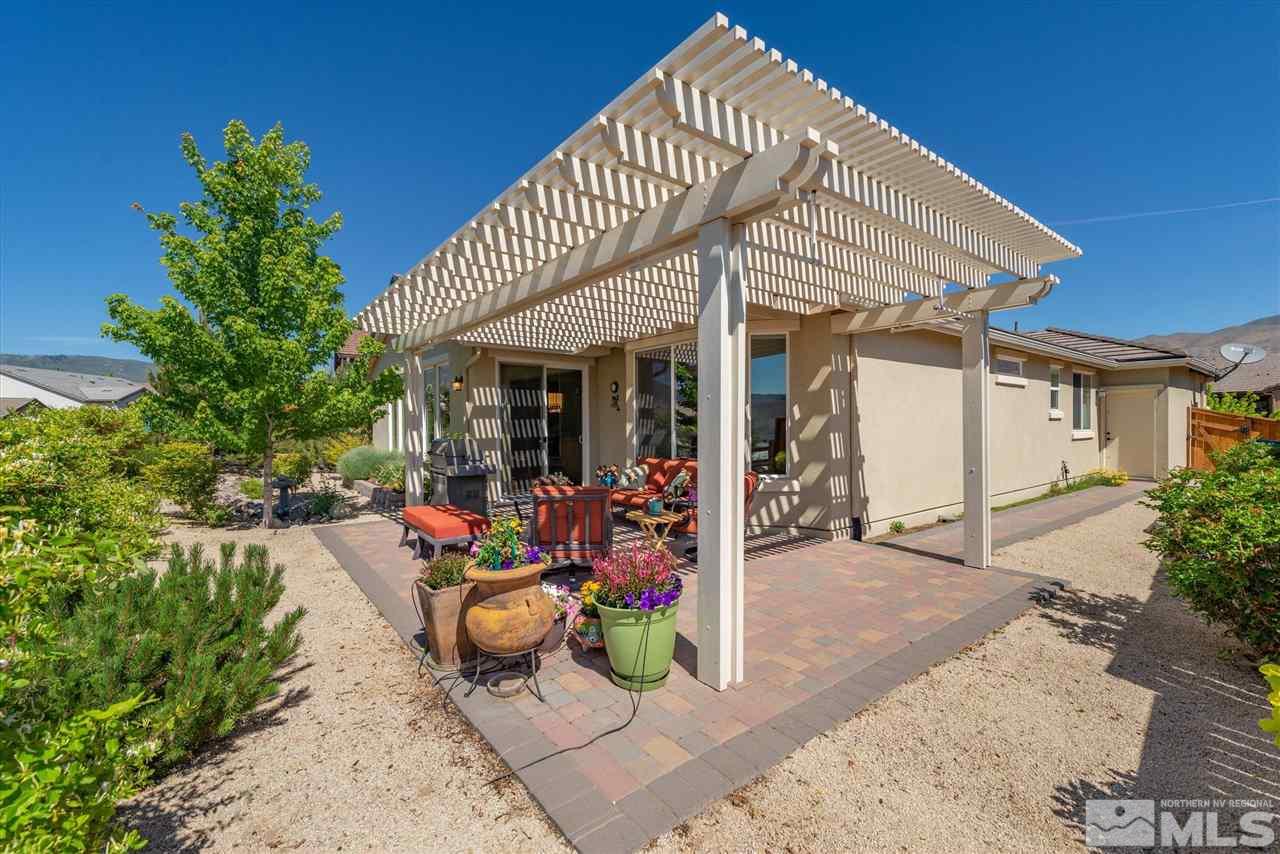 1149 Dutch Hollow Trail Reno, NV 89523 - Photo 19 of 38 a view of a house with sitting area and potted plants