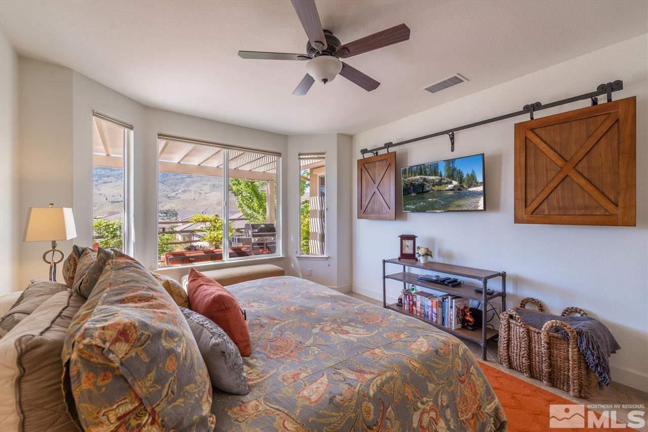 1149 Dutch Hollow Trail Reno, NV 89523 - Photo 21 of 38 a bed sitting in a bedroom next to a window
