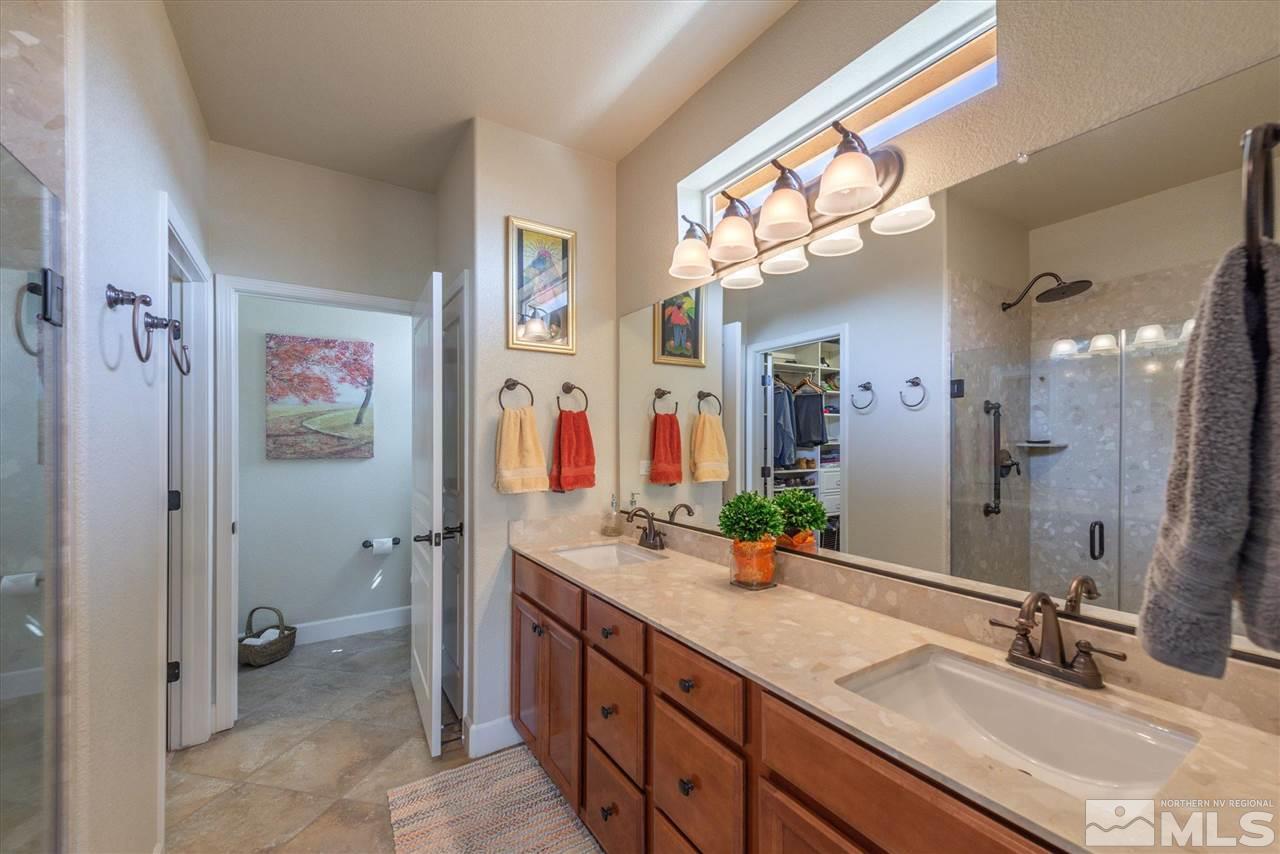 1149 Dutch Hollow Trail Reno, NV 89523 - Photo 22 of 38 a bathroom with a double vanity sink mirror and shower