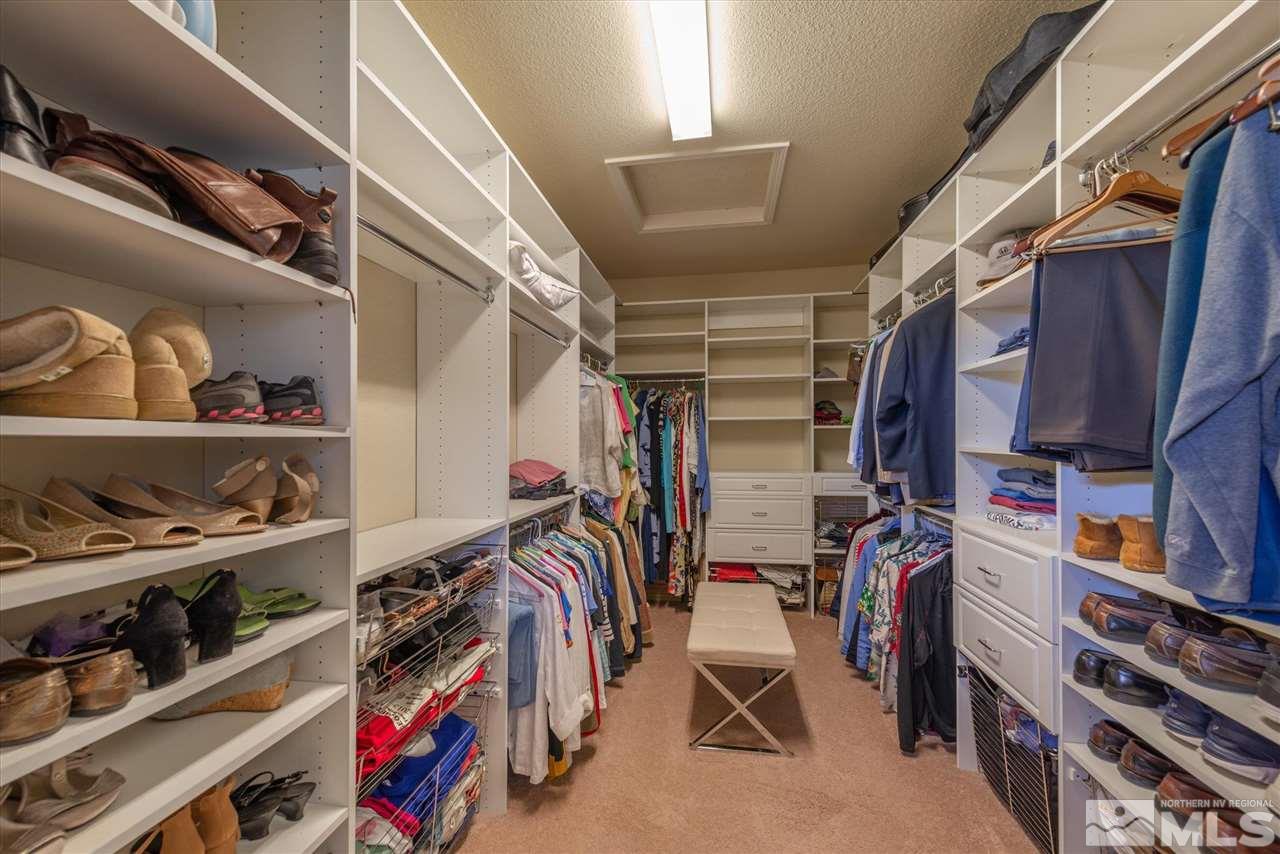 1149 Dutch Hollow Trail Reno, NV 89523 - Photo 24 of 38 a view of walk in closet with clothes and shoes