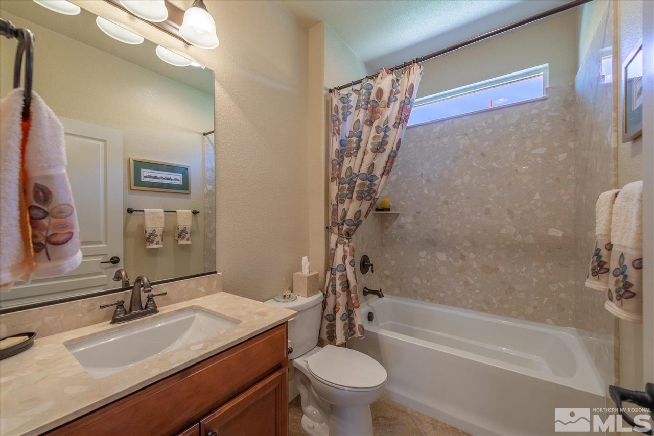 1149 Dutch Hollow Trail Reno, NV 89523 - Photo 26 of 38 a bathroom with a granite countertop sink toilet and shower