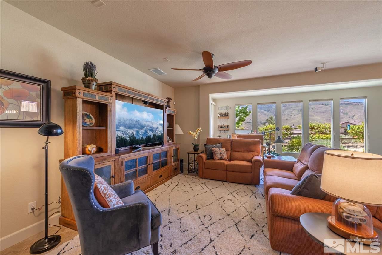 1149 Dutch Hollow Trail Reno, NV 89523 - Photo 5 of 38 a living room with furniture and a flat screen tv