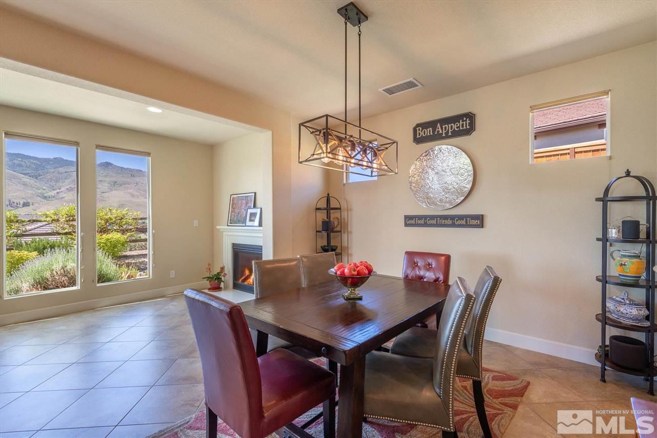 1149 Dutch Hollow Trail Reno, NV 89523 - Photo 10 of 38 a view of a dining room with furniture window and wooden floor