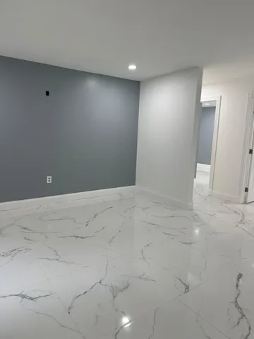 an empty room with a fireplace