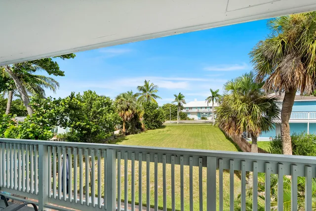 a view of swimming pool from a balcony